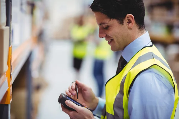 Warehouse worker using hand scanner — Stock Photo, Image