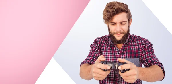 Imagem composta de hipster jogando videogame — Fotografia de Stock