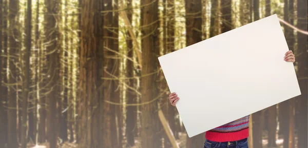 Hipster woman behind a big white card — Stock Photo, Image