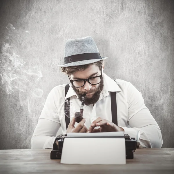 Hipster smoking pipe while working at desk — Stock Photo, Image