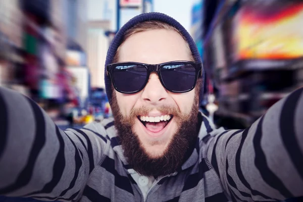 Happy hipster wearing sunglasses — Stock Photo, Image
