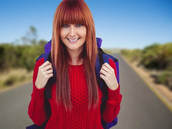 Smiling hipster woman with a travel bag taking — Stock Photo, Image