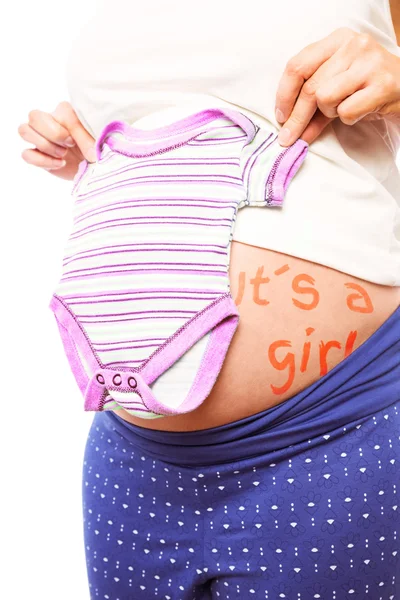 Zwangere vrouw houdt van pyjama over haar buik — Stockfoto