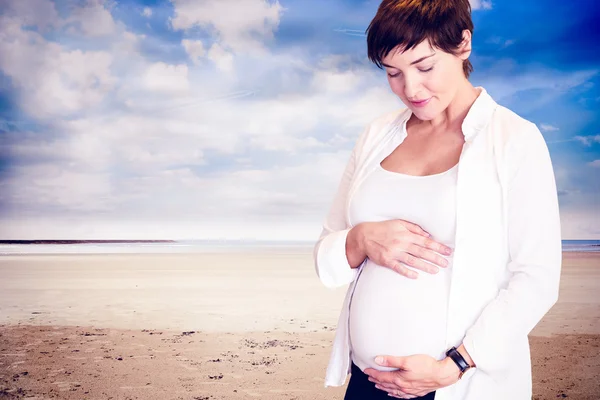 Pregnant woman holding belly — Stock Photo, Image