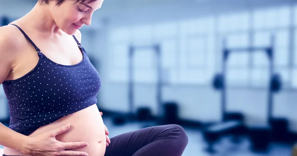 Pregnant woman holding belly — Stock Photo, Image