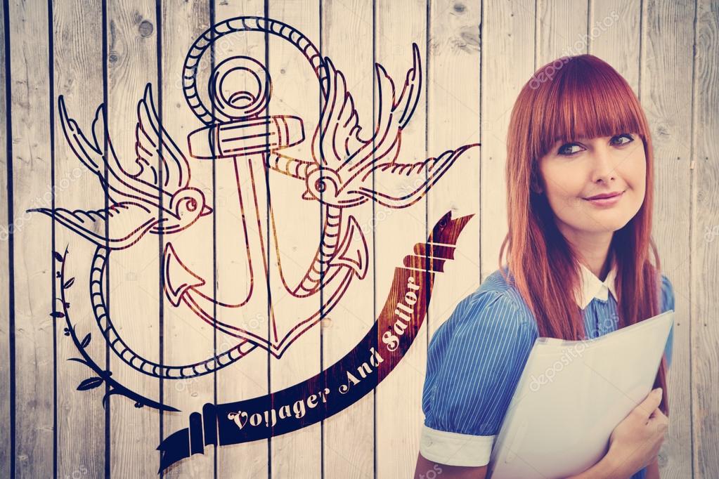 Smiling hipster woman holding document  against wooden planks