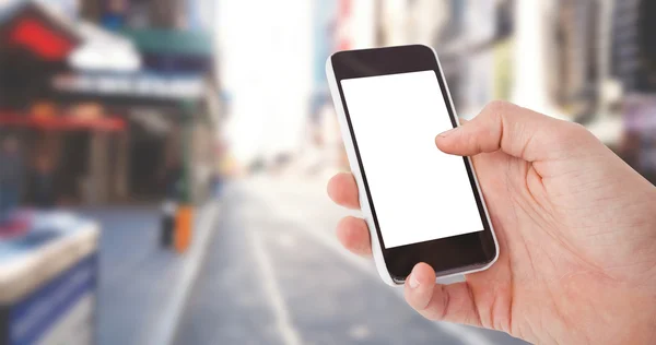 Mano del hombre usando el teléfono inteligente — Foto de Stock