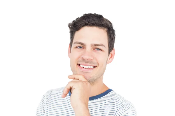 Uomo sorridente con mano sul mento — Foto Stock