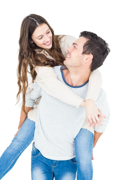 Man giving piggy back to girlfriend — Stock Photo, Image