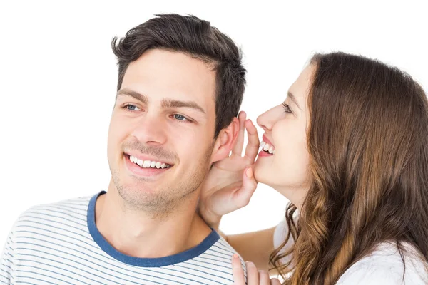 Young couple sharing secret — Stock Photo, Image