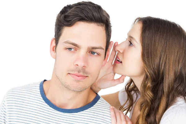 Young couple sharing secret — Stock Photo, Image