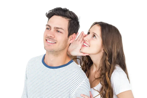 Casal jovem compartilhando um segredo — Fotografia de Stock