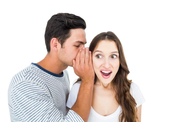 Young couple sharing secret — Stock Photo, Image