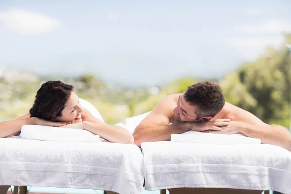 Young couple relaxing on massage table