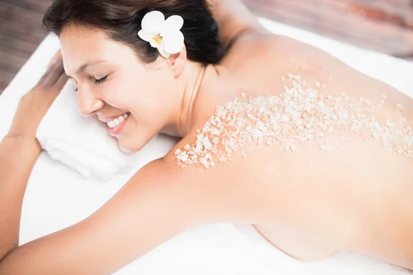 Woman lying on massage table — Stock Photo, Image