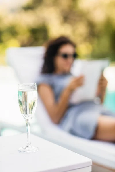 Champagne flute on side table — Stock Photo, Image