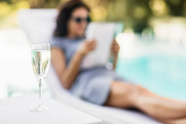 Champagne flute on side table — Stock Photo, Image