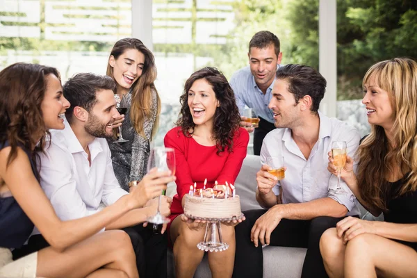 Woman celebrating birthday with friends — Stock Photo, Image