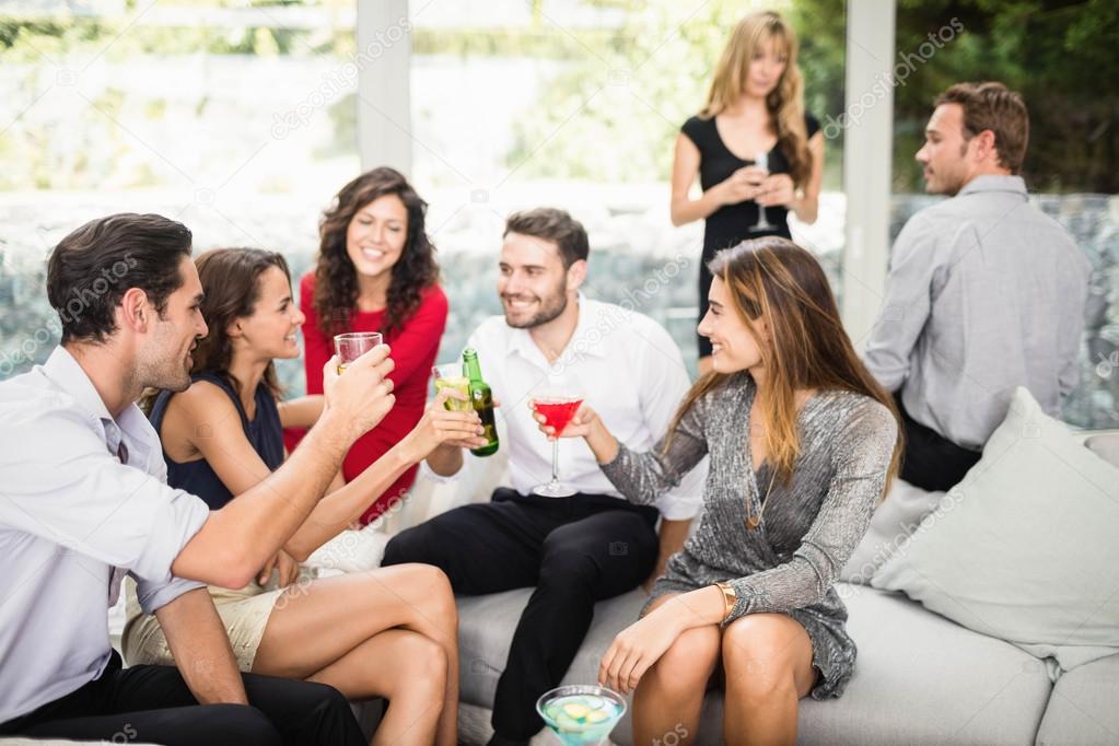 Friends Talking And Having Drinks — Stock Photo © Wavebreakmedia 100668476
