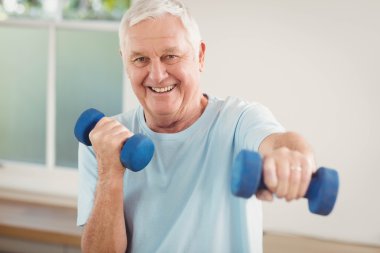 senior man exercising with dumbbells clipart