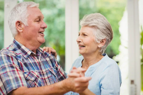 Senior couple dancing at home — Stock Photo, Image