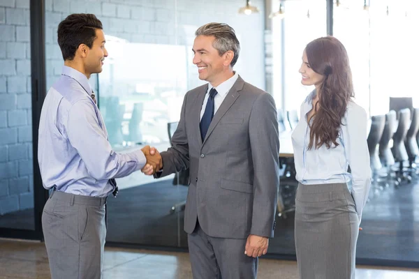 Business team interacting in office — Stock Photo, Image