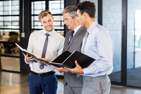 Business team with document and organizer — Stock Photo, Image