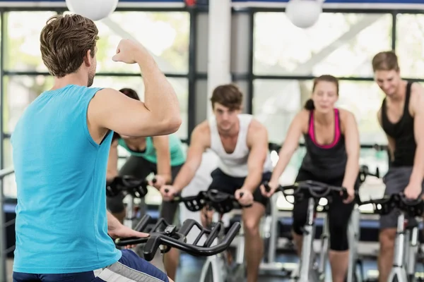 People using exercise bike together — Stock Photo, Image