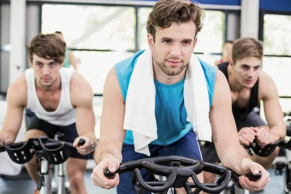 People using exercise bike together — Stock Photo, Image