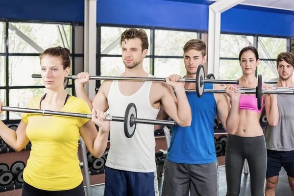 Fitness klasse hijs barbell — Stockfoto