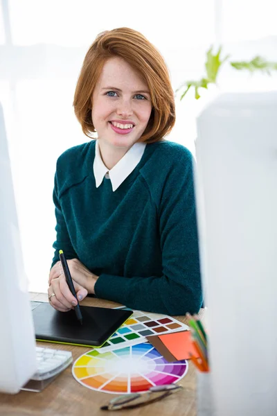 Hipster designer writing on tablet — Stock Photo, Image