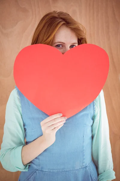 Hipster holding red heart shape — Stock Photo, Image