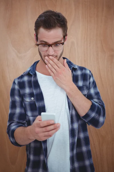 Handsome hipster using smartphone — Stock Photo, Image