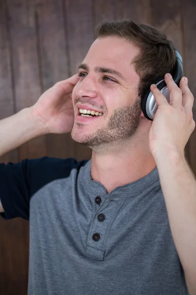 Handsome hipster listening to music — Stock Photo, Image