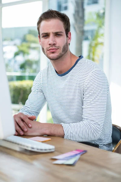Handsome hipster working on computer — Stock Photo, Image