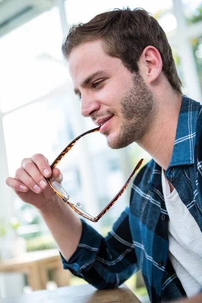 Man working and chewing glasses — Stock Photo, Image