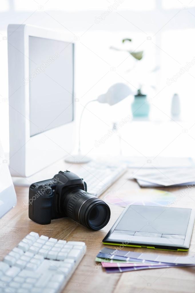 Digital camera on an office desk — Stock Photo © Wavebreakmedia #100972494