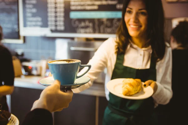 Waitress serving cup of coffee — Stock Photo, Image