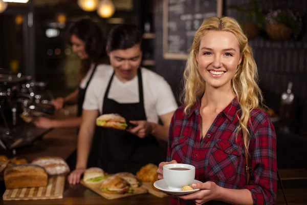 Blonde customer in front of counter — Stock Photo, Image