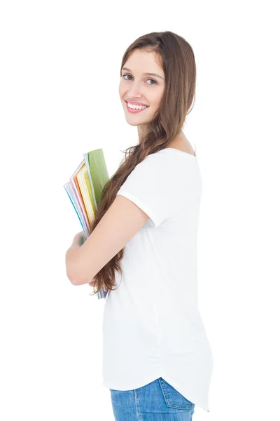 Zijaanzicht van de vrouwelijke college student glimlachen — Stockfoto