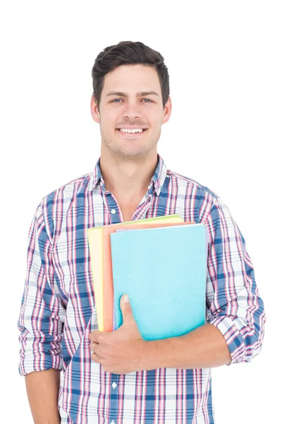 Erkek kolej öğrenci holding kitaplar gülümseyen — Stok fotoğraf