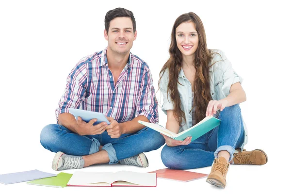 Happy couple studying with books — Stock Photo, Image