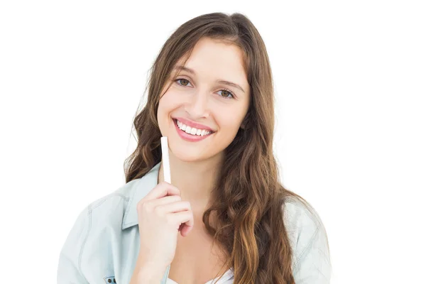 Thoughtful female student holding a chalk — Stock Photo, Image