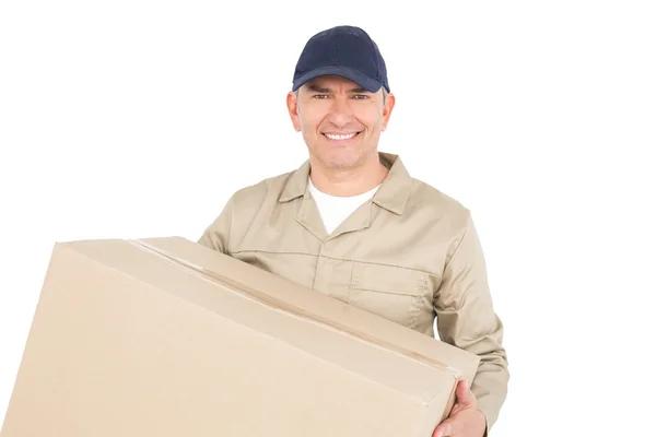 Delivery man carrying a package — Stock Photo, Image