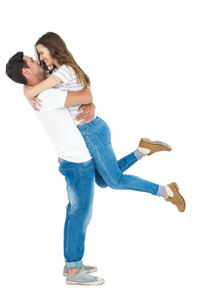 Boyfriend carrying his girlfriend — Stock Photo, Image