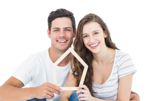Glückliches Paar hält Haus in Form — Stockfoto