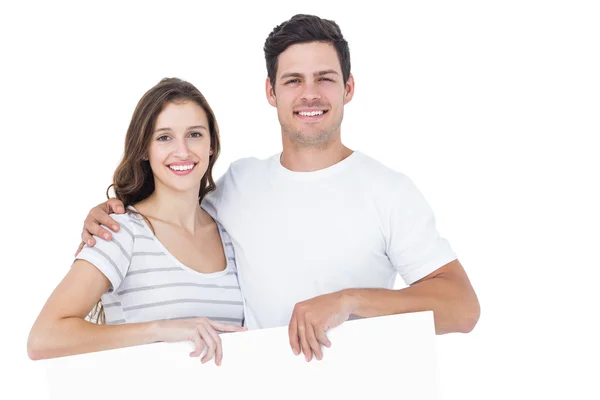 Glückliches Paar mit einem Plakat — Stockfoto