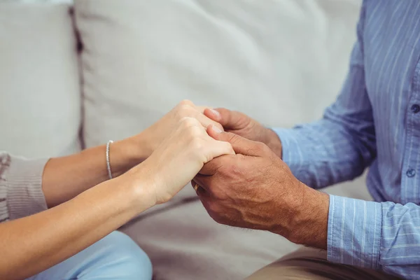 Close-up of man and woman holding hands — Stock Photo, Image