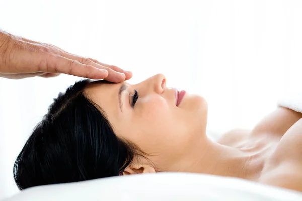 Pregnant woman receiving a head massage from masseur — Stock Photo, Image