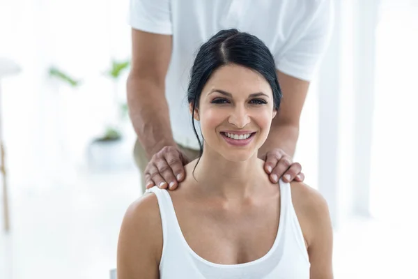 Doctor giving physiotherapy to pregnant woman — Stock Photo, Image